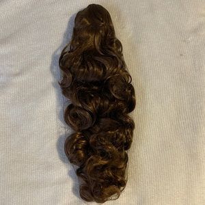 Hair extension with a clip